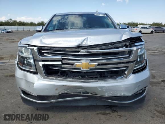 2020 Chevrolet Suburban Premier с VIN 1GNSCJKC0LR216855, выставлен на аукционе Copart как лот 72287114 с пробегом 94 642 миль миль и Списание • Salvage title. История ставок и продаж доступна на DreamBid. Изображение 5.