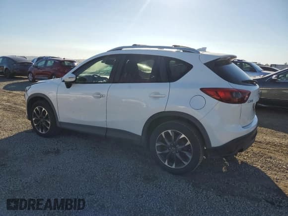 ✅ 2016 Mazda CX-5 Grand Touring • VIN: JM3KE2DY2G0901474 • Лот: 87113395. Опубликован ранее на Copart с пробегом 137 442 миль. Бесплатный доступ к архиву аукционных продаж из США и подробный отчёт об истории автомобиля на DreamBid. Изображение 2.
