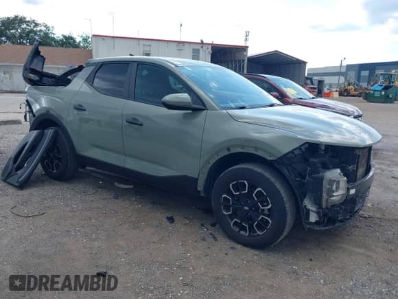 2023 Hyundai Santa Cruz SE z VIN 5NTJA4AE2PH043675, wystawiony jako IAAI lot #42589673 z przebiegiem 46 874 mil mil oraz . Historia ofert i sprzedaży dostępna na DreamBid. Obrazek 1.