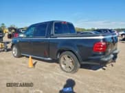 ✅ 2003 Ford F-150 Harley-Davidson • VIN: 1FTRW07343KD83293 • Lot: 94547995. Listed on Copart with 176,233 mi. Free auction sales archive from the USA and detailed vehicle history report at DreamBid. Image 2.