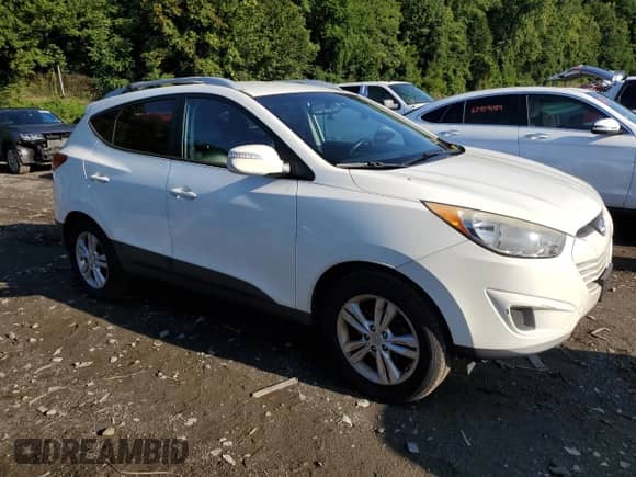 2012 Hyundai Tucson GLS z VIN KM8JUCAC7CU493526, wystawiony jako Copart lot #67942934 z przebiegiem 113 316 mil mil oraz Szkoda całkowita • Salvage title. Historia ofert i sprzedaży dostępna na DreamBid. Obrazek 4.
