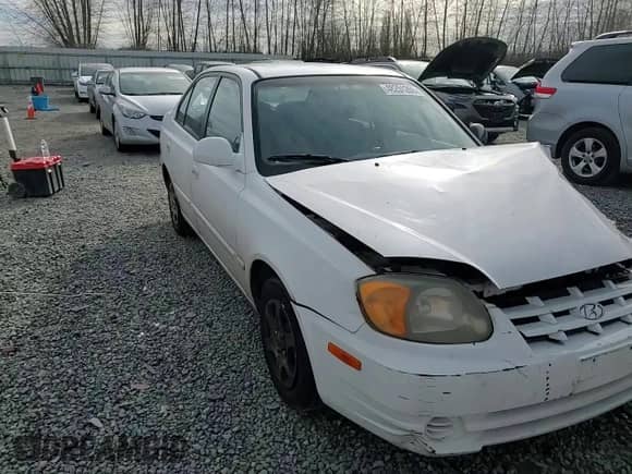 2003 Hyundai Accent GL z VIN KMHCG45C63U485420, wystawiony jako Copart lot #48251265 z przebiegiem 139 179 mil mil oraz Szkoda całkowita • Salvage title. Historia ofert i sprzedaży dostępna na DreamBid. Obrazek 11.