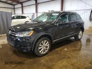 ✅ 2013 Volkswagen Touareg Lux • VIN: WVGEF9BP7DD007945 • Lot: 65758255. Listed on Copart with 90,086 mi. Free auction sales archive from the USA and detailed vehicle history report at DreamBid. Image 1.