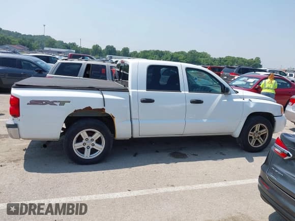 ✅ 2007 Dodge Dakota ST • VIN: 1D7HW28KX7S270795 • Лот: 42452595. Опубликован ранее на IAAI с пробегом 206 775 миль. Бесплатный доступ к архиву аукционных продаж из США и подробный отчёт об истории автомобиля на DreamBid. Изображение 13.