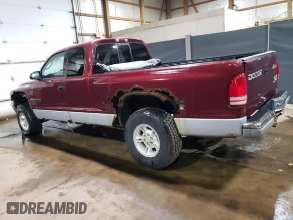 2000 Dodge Dakota Sport z VIN 1B7GG22NXYS573079, wystawiony jako Copart lot #66582204 z przebiegiem 128 435 mil mil oraz Czysty tytuł • Clean title. Historia ofert i sprzedaży dostępna na DreamBid. Obrazek 2.