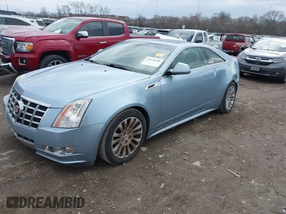 ✅ 2013 Cadillac CTS Performance • VIN: 1G6DJ1E30D0116444 • Lot: 41570540. Listed on IAAI with 104,660 mi. Free auction sales archive from the USA and detailed vehicle history report at DreamBid. Image 2.