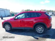 ✅ 2016 Mazda CX-5 Touring • VIN: JM3KE4CY6G0890119 • Lot: 43610292. Wystawiony na IAAI z przebiegiem 119 195 mil. Bezpłatny archiwum sprzedaży aukcyjnych z USA i szczegółowy raport historii pojazdu na DreamBid. Zdjęcie 14.