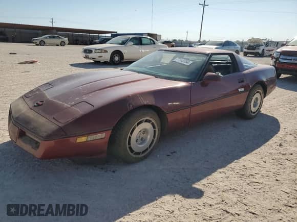 1986 Chevrolet Corvette with VIN 1G1YY0789G5118657, listed as a Copart auction lot 77743794 with 97,673 mi miles and Salvage title. Bid and sale history available at DreamBid. Image 1.