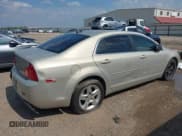 ✅ 2012 Chevrolet Malibu 1LS • VIN: 1G1ZB5E03CF106864 • Lot: 43016130. Listed on IAAI with 284,047 mi. Free auction sales archive from the USA and detailed vehicle history report at DreamBid. Image 4.