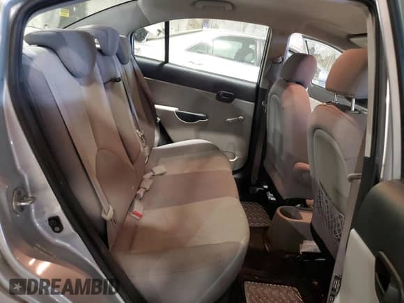 2009 Hyundai Accent Auto GLS z VIN KMHCN46C99U306008, wystawiony jako Copart lot #74152544 z przebiegiem 124 576 mil mil oraz Szkoda całkowita • Salvage title. Historia ofert i sprzedaży dostępna na DreamBid. Obrazek 11.