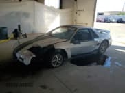 ✅ 1987 Pontiac Fiero • VIN: 1G2PF1191HP224790 • Lot: 70424675. Listed on Copart with 90,703 mi. Free auction sales archive from the USA and detailed vehicle history report at DreamBid. Image 1.