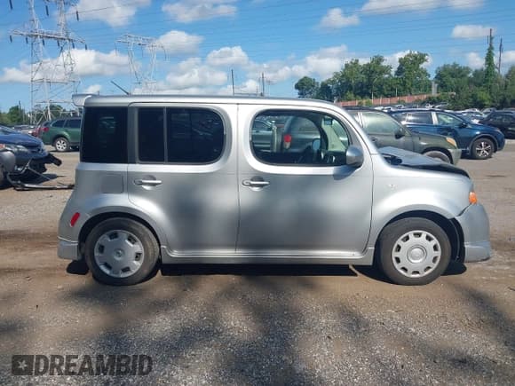 ✅ 2009 Nissan Cube S • VIN: JN8AZ28R99T106634 • Lot: 42929559. Wystawiony na IAAI z przebiegiem 228 284 mil. Bezpłatny archiwum sprzedaży aukcyjnych z USA i szczegółowy raport historii pojazdu na DreamBid. Zdjęcie 14.