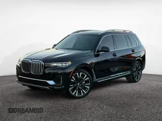 ✅ 2019 BMW X7 xDrive50i • VIN: 5UXCX4C58KLS38928 • Лот: 93027945. Опубликован ранее на Copart с пробегом 98 606 миль. Бесплатный доступ к архиву аукционных продаж из США и подробный отчёт об истории автомобиля на DreamBid. Изображение 2.