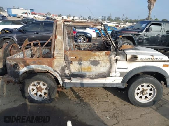 ✅ 1987 Suzuki Samurai • VIN: JS4JC51C3H4189102 • Lot: 42715087. Wystawiony na IAAI z przebiegiem Nie podano. Bezpłatny archiwum sprzedaży aukcyjnych z USA i szczegółowy raport historii pojazdu na DreamBid. Zdjęcie 12.