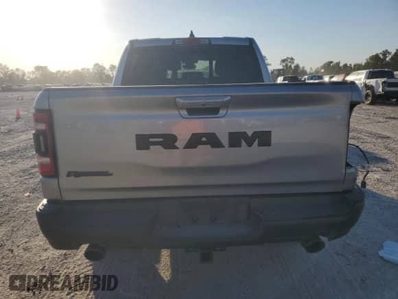 2020 Ram 1500 Rebel с VIN 1C6RRELT7LN299176, выставлен на аукционе Copart как лот 76778334 с пробегом 70 059 миль миль и Списание • Salvage title. История ставок и продаж доступна на DreamBid. Изображение 6.