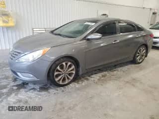 2013 Hyundai Sonata SE with VIN 5NPEC4AB2DH665074, listed as a Copart auction lot 82671065 with 217,629 mi miles and Clean title. Bid and sale history available at DreamBid. Image 1.