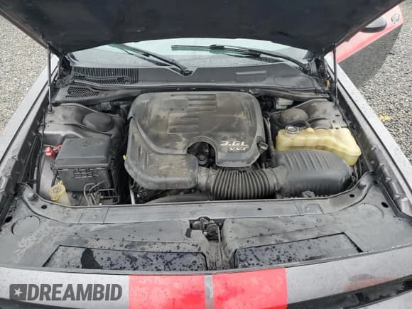 ✅ 2013 Dodge Challenger SXT • VIN: 2C3CDYAG1DH607591 • Lot: 74416884. Wystawiony na Copart z przebiegiem Nie podano. Bezpłatny archiwum sprzedaży aukcyjnych z USA i szczegółowy raport historii pojazdu na DreamBid. Zdjęcie 11.