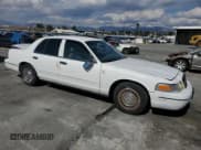 ✅ 1999 Ford Crown Victoria Police • VIN: 2FAFP71W0XX222766 • Lot: 82093825. Wystawiony na Copart z przebiegiem 97 010 mil. Bezpłatny archiwum sprzedaży aukcyjnych z USA i szczegółowy raport historii pojazdu na DreamBid. Zdjęcie 4.
