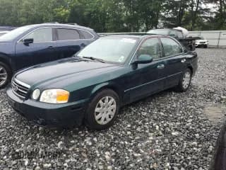 ✅ 2004 Kia Optima LX • VIN: KNAGD126445283552 • Lot: 63195385. Wystawiony na Copart z przebiegiem 99 675 mil. Bezpłatny archiwum sprzedaży aukcyjnych z USA i szczegółowy raport historii pojazdu na DreamBid. Zdjęcie 1.