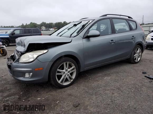 2010 Hyundai Elantra SE with VIN KMHDC8AE6AU068617, listed as a Copart auction lot 69657295 with 84,999 mi miles and Salvage title. Bid and sale history available at DreamBid. Image 1.