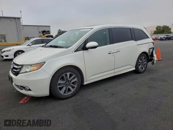 ✅ 2015 Honda Odyssey Touring Elite • VIN: 5FNRL5H94FB104726 • Lot: 96195135. Listed on Copart with 51,594 mi. Free auction sales archive from the USA and detailed vehicle history report at DreamBid. Image 1.