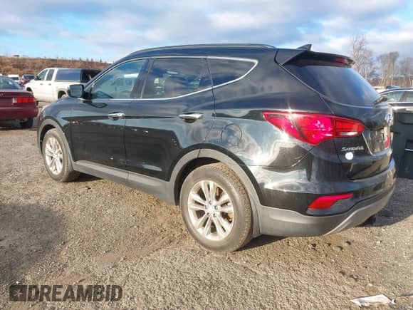 2017 Hyundai Santa Fe 2.0T z VIN 5XYZUDLA8HG502333, wystawiony jako IAAI lot #41246195 z przebiegiem 62 772 mil mil oraz . Historia ofert i sprzedaży dostępna na DreamBid. Obrazek 3.