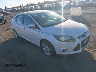 ✅ 2014 Ford Focus Titanium • VIN: 1FADP3J25EL252904 • Lot: 43674294. Listed on IAAI with 75,000 mi. Free auction sales archive from the USA and detailed vehicle history report at DreamBid. Image 1.