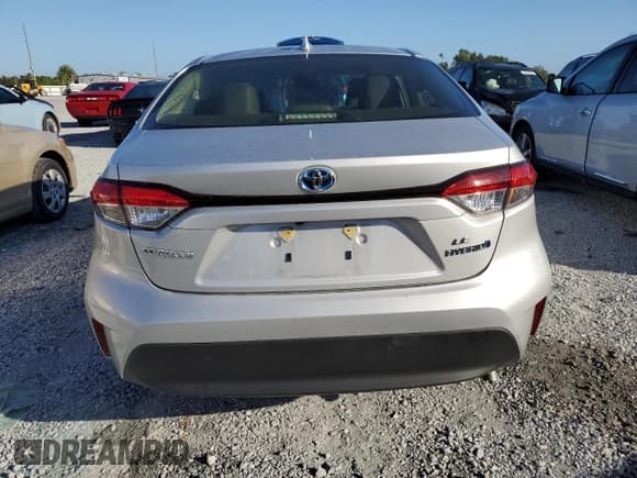 ✅ 2024 Toyota Corolla Hybrid LE • VIN: JTDBCMFE4RJ035934 • Лот: 85841945. Опубликован ранее на Copart с пробегом 21 102 миль. Бесплатный доступ к архиву аукционных продаж из США и подробный отчёт об истории автомобиля на DreamBid. Изображение 6.