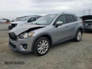 ✅ 2014 Mazda CX-5 Grand Touring • VIN: JM3KE4DYXE0333340 • Лот: 93077745. Опубликован ранее на Copart с пробегом 102 473 миль. Бесплатный доступ к архиву аукционных продаж из США и подробный отчёт об истории автомобиля на DreamBid. Изображение 1.