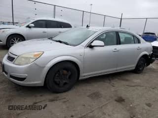 2009 Saturn Aura XE z VIN 1G8ZS57B09F158011, wystawiony jako Copart lot #69934905 z przebiegiem 203 855 mil mil oraz Szkoda całkowita • Salvage title. Historia ofert i sprzedaży dostępna na DreamBid. Obrazek 1.