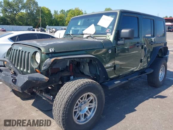 ✅ 2007 Jeep Wrangler Unlimited Sahara • VIN: 1J4GA59157L198095 • Lot: 43011519. Listed on IAAI with 198,022 mi. Free auction sales archive from the USA and detailed vehicle history report at DreamBid. Image 17.