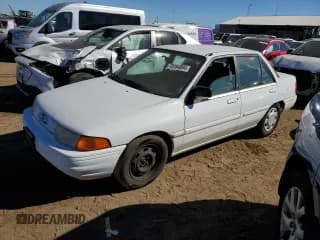 ✅ 1994 Ford Escort • VIN: 3FARP13J4RR122084 • Лот: 73184804. Опубликован ранее на Copart с пробегом 238 604 миль. Бесплатный доступ к архиву аукционных продаж из США и подробный отчёт об истории автомобиля на DreamBid. Изображение 1.