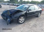 ✅ 2004 Ford Taurus SE • VIN: 1FAFP53284G179777 • Lot: 43053159. Wystawiony na IAAI z przebiegiem Nie podano. Bezpłatny archiwum sprzedaży aukcyjnych z USA i szczegółowy raport historii pojazdu na DreamBid. Zdjęcie 2.