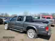 2003 Dodge Dakota Sport z VIN 1D7HG38N13S101403, wystawiony jako Copart lot #50814875 z przebiegiem 15 396 mil mil oraz Czysty tytuł • Clean title. Historia ofert i sprzedaży dostępna na DreamBid. Obrazek 2.