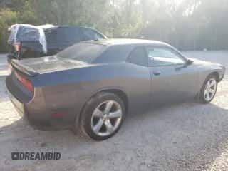 2014 Dodge Challenger SXT z VIN 2C3CDYAG4EH313829, wystawiony jako Copart lot #68274174 z przebiegiem Nie podano mil oraz Szkoda całkowita • Salvage title. Historia ofert i sprzedaży dostępna na DreamBid. Obrazek 3.