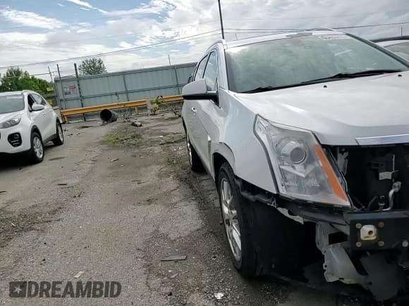 ✅ 2013 Cadillac SRX Performance Collection • VIN: 3GYFNHE36DS521908 • Lot: 65402415. Listed on Copart with 124,799 mi. Free auction sales archive from the USA and detailed vehicle history report at DreamBid. Image 15.