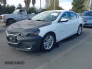 ✅ 2018 Chevrolet Malibu Hybrid • VIN: 1G1ZF5SU8JF140033 • Lot: 43673797. Listed on IAAI with 111,657 mi. Free auction sales archive from the USA and detailed vehicle history report at DreamBid. Image 2.