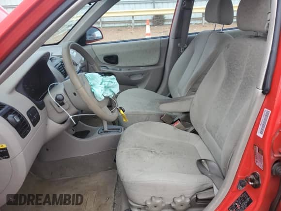 2005 Hyundai Accent GLS with VIN KMHCG45C15U652785, listed as a Copart auction lot 65780725 with 167,670 mi miles and Clean title. Bid and sale history available at DreamBid. Image 7.