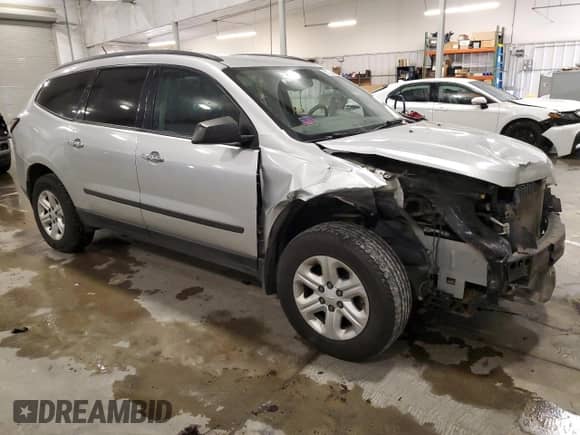 2015 Chevrolet Traverse LS with VIN 1GNKVFED3FJ252117, listed as a Copart auction lot 82729045 with 184,244 mi miles and Salvage title. Bid and sale history available at DreamBid. Image 4.