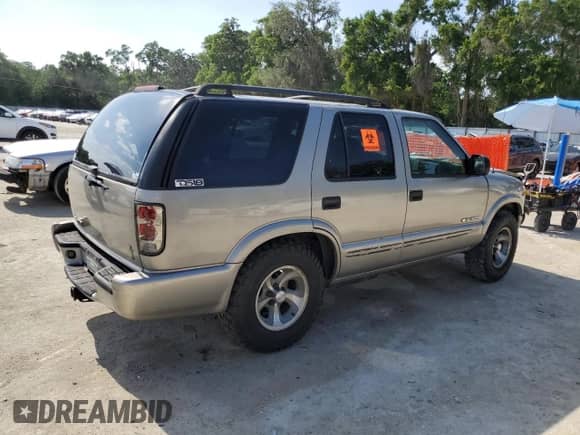 2004 Chevrolet Blazer Fleet z VIN 1GNCS13X84K110611, wystawiony jako Copart lot #54654165 z przebiegiem 153 610 mil mil oraz Szkoda całkowita • Salvage title. Historia ofert i sprzedaży dostępna na DreamBid. Obrazek 3.