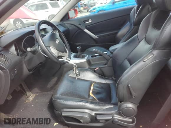 2010 Hyundai Genesis Coupe Track with VIN KMHHU6KH9AU023246, listed as a Copart auction lot 70192645 with 112,380 mi miles and Salvage title. Bid and sale history available at DreamBid. Image 7.