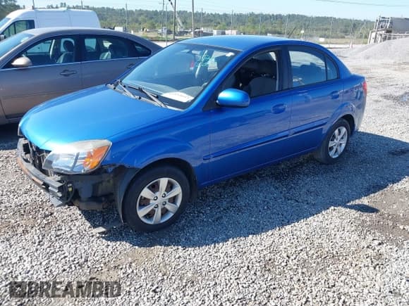 ✅ 2010 Kia Rio LX • VIN: KNADH4A39A6660317 • Lot: 43322093. Listed on IAAI with 70,003 mi. Free auction sales archive from the USA and detailed vehicle history report at DreamBid. Image 2.