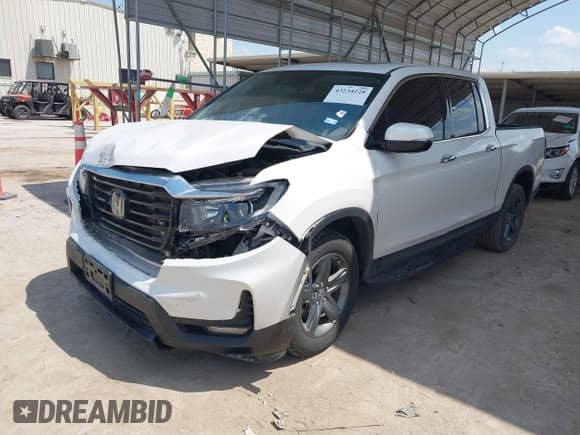 ✅ 2023 Honda Ridgeline RTL-E • VIN: 5FPYK3F72PB035287 • Lot: 43234228. Listed on IAAI with 15,634 mi. Free auction sales archive from the USA and detailed vehicle history report at DreamBid. Image 2.