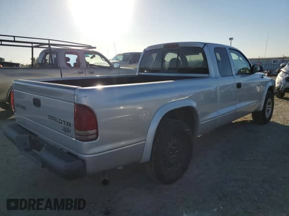 2004 Dodge Dakota z VIN 1D7GL12K64S533612, wystawiony jako Copart lot #79676404 z przebiegiem 102 575 mil mil oraz Czysty tytuł • Clean title. Historia ofert i sprzedaży dostępna na DreamBid. Obrazek 3.