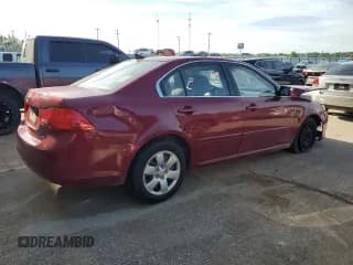 ✅ 2009 Kia Optima LX • VIN: KNAGE228495305531 • Лот: 58291934. Опубликован ранее на Copart с пробегом 237 098 миль. Бесплатный доступ к архиву аукционных продаж из США и подробный отчёт об истории автомобиля на DreamBid. Изображение 3.