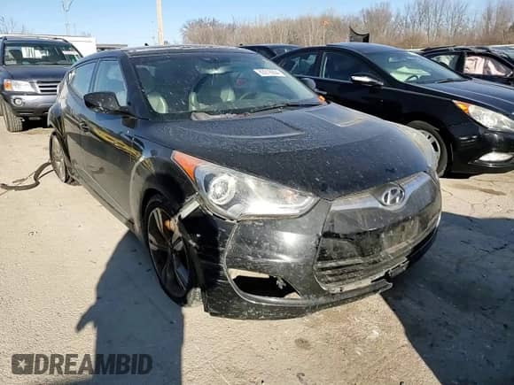 2012 Hyundai Veloster w/Red Int z VIN KMHTC6AD5CU030242, wystawiony jako Copart lot #83016604 z przebiegiem 142 555 mil mil oraz Szkoda całkowita • Salvage title. Historia ofert i sprzedaży dostępna na DreamBid. Obrazek 13.