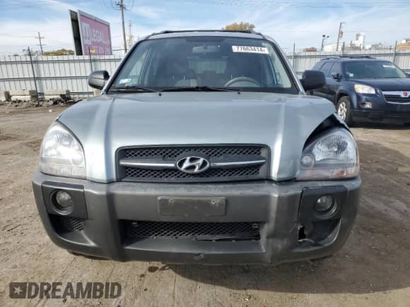 2009 Hyundai Tucson GLS with VIN KM8JM12B79U012399, listed as a Copart auction lot 77663414 with 164,615 mi miles and Salvage title. Bid and sale history available at DreamBid. Image 5.