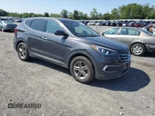 ✅ 2018 Hyundai Santa Fe 2.4L • VIN: 5XYZTDLBXJG563426 • Лот: 68144014. Опубликован ранее на Copart с пробегом 96 666 миль. Бесплатный доступ к архиву аукционных продаж из США и подробный отчёт об истории автомобиля на DreamBid. Изображение 4.