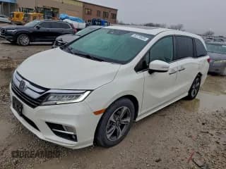 ✅ 2018 Honda Odyssey Touring • VIN: 5FNRL6H88JB053124 • Lot: 93779525. Wystawiony na Copart z przebiegiem 106 865 mil. Bezpłatny archiwum sprzedaży aukcyjnych z USA i szczegółowy raport historii pojazdu na DreamBid. Zdjęcie 1.