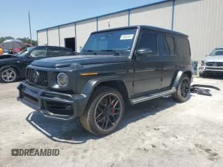 ✅ 2023 Mercedes-Benz G 63 AMG • VIN: W1NYC7HJ6PX473086 • Lot: 69606965. Wystawiony na Copart z przebiegiem 9 577 mil. Bezpłatny archiwum sprzedaży aukcyjnych z USA i szczegółowy raport historii pojazdu na DreamBid. Zdjęcie 1.